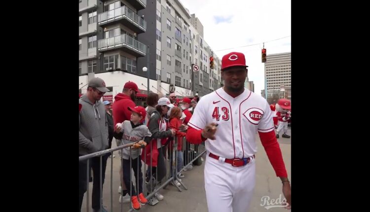 Reds players and mascots greet fans on 2023 Kids Opening Day